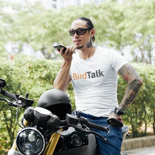bird-talk-crewneck-tee-mockup-of-a-tattooed-man-on-his-motorcycle